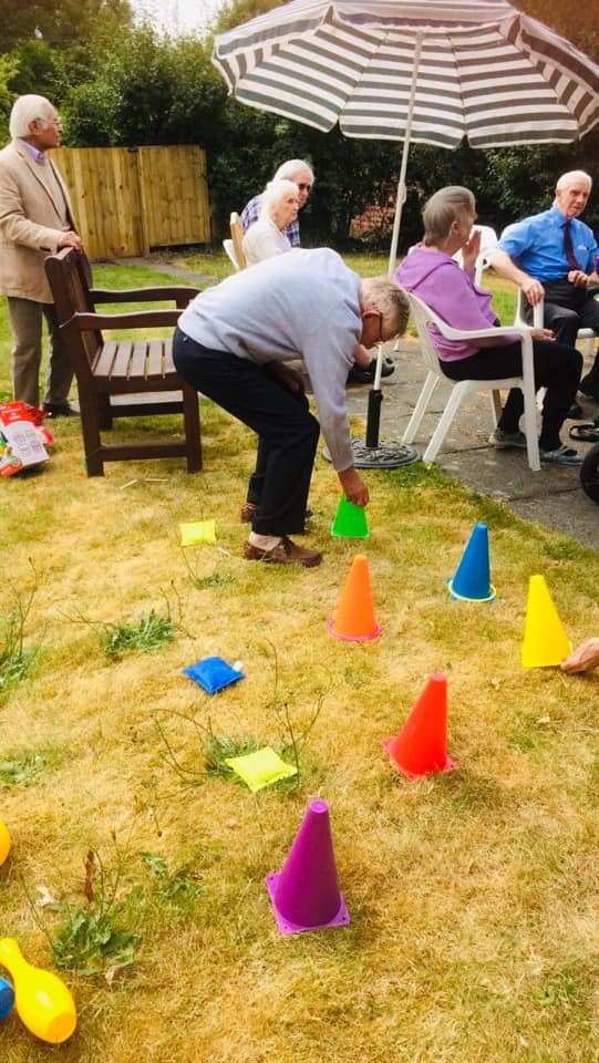 Resident Playing Games Outdoors in the New Garden Area