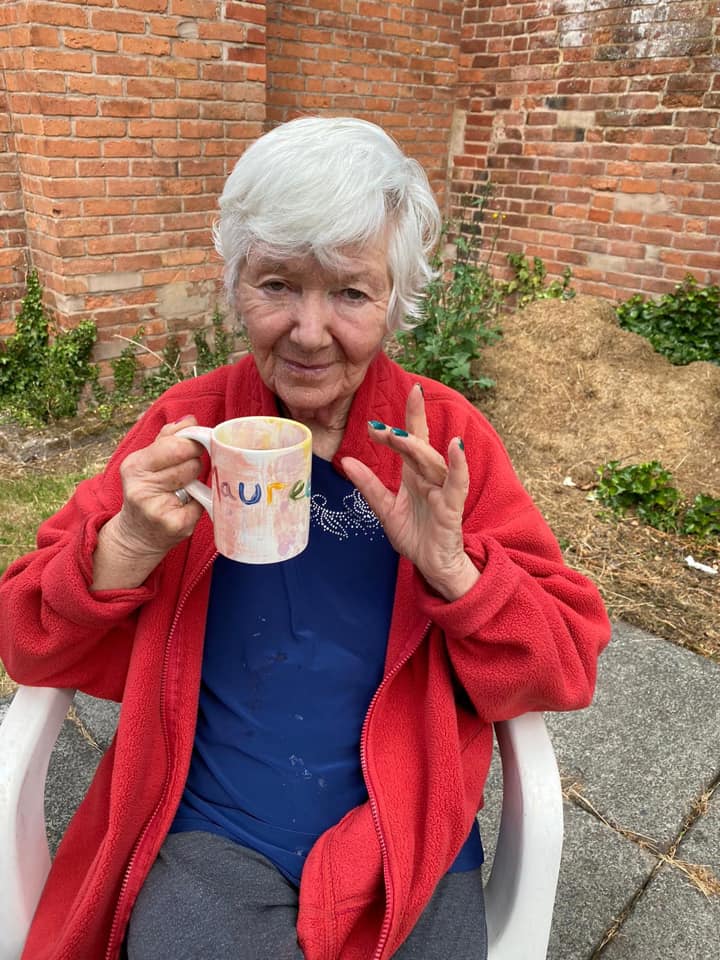 Resident Enjoying Tea in the New Garden Area